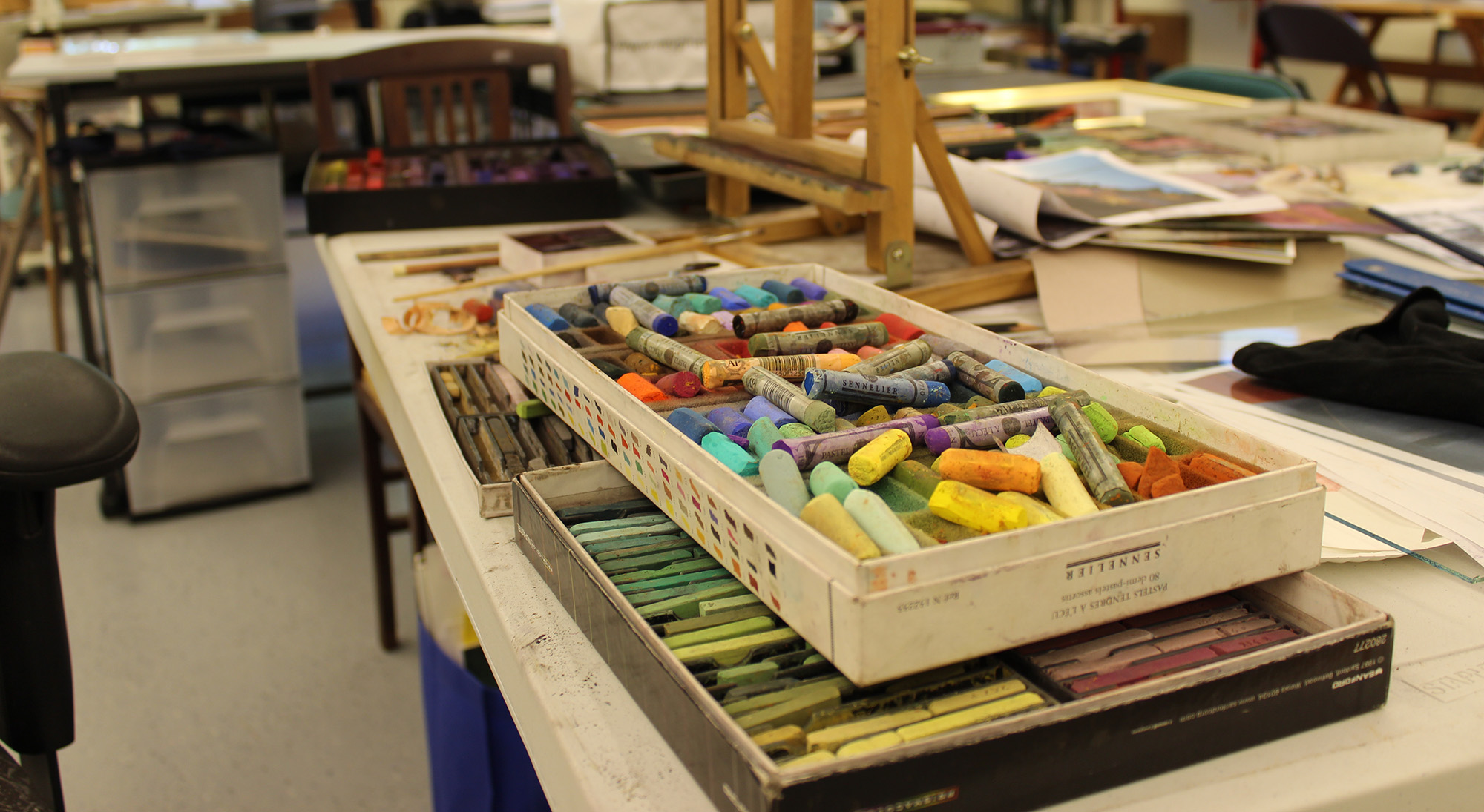 Box of pastels in art studio