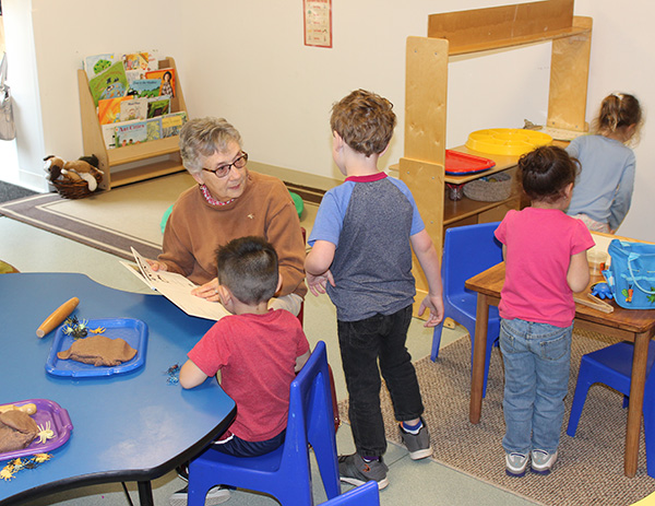 Resident reads to children